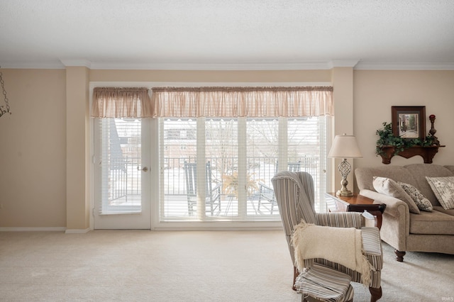 sitting room featuring a healthy amount of sunlight, carpet floors, and ornamental molding