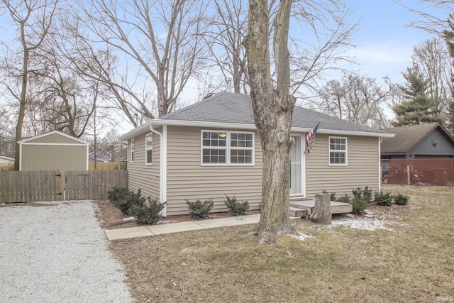 rear view of house with a lawn