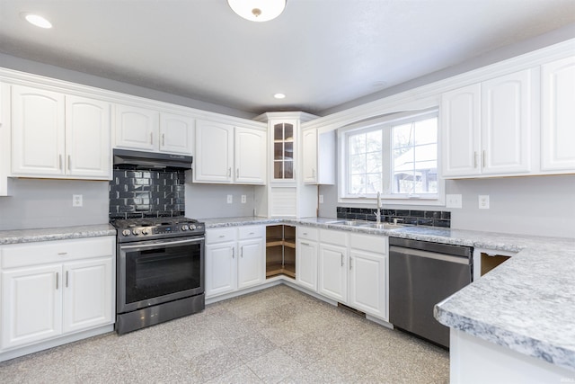 kitchen featuring white cabinets, appliances with stainless steel finishes, and sink