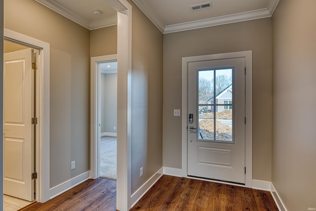 entryway featuring ornamental molding, wood finished floors, visible vents, and baseboards