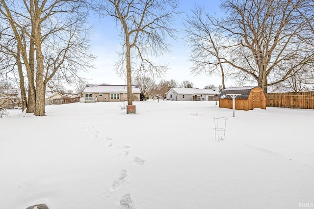 view of yard layered in snow