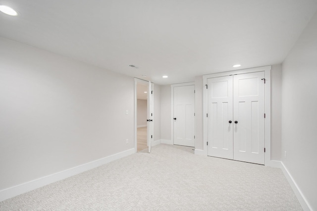 unfurnished bedroom featuring light colored carpet