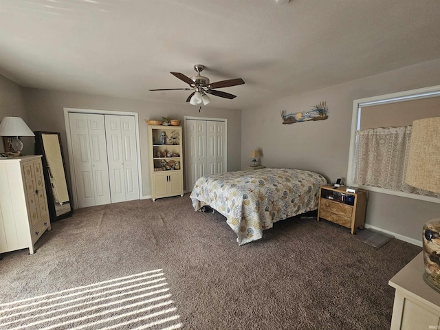 carpeted bedroom featuring ceiling fan and multiple closets