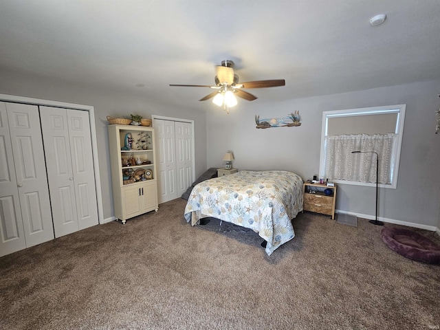 carpeted bedroom with two closets and ceiling fan