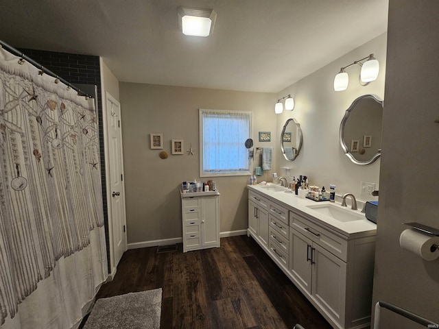 bathroom featuring hardwood / wood-style flooring and vanity