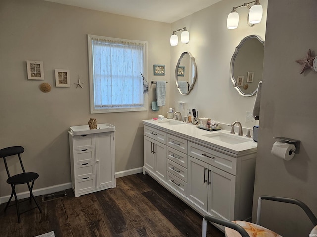 bathroom featuring vanity and wood-type flooring