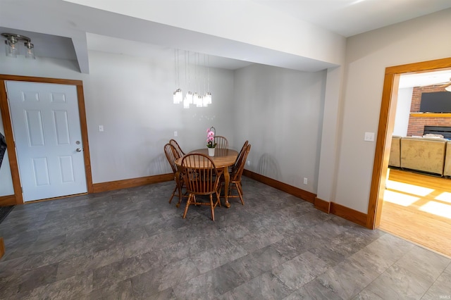 unfurnished dining area featuring a fireplace