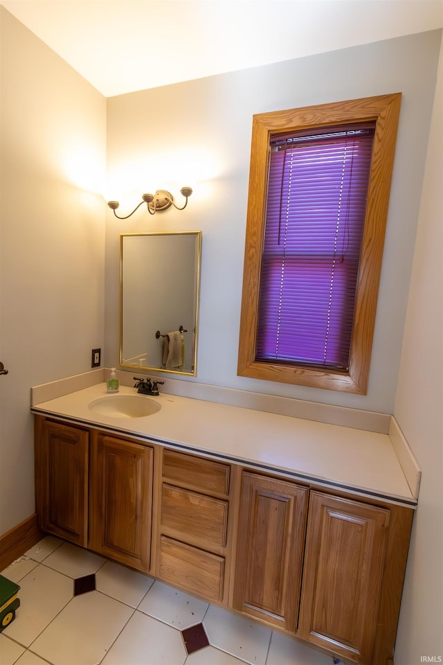 bathroom with tile patterned floors and vanity