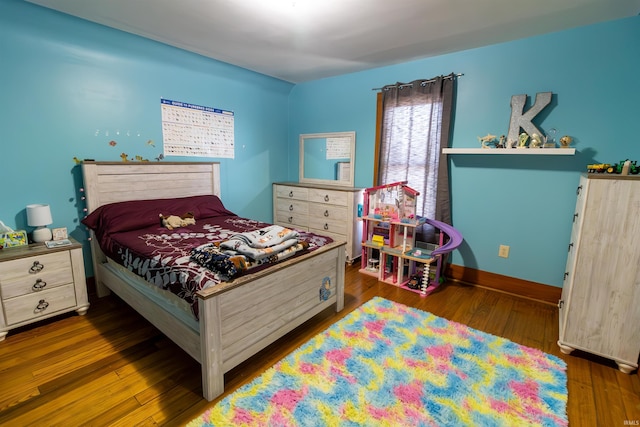 bedroom featuring dark hardwood / wood-style flooring