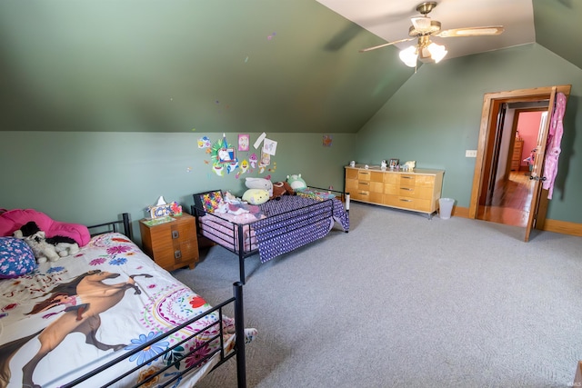 carpeted bedroom with vaulted ceiling and ceiling fan