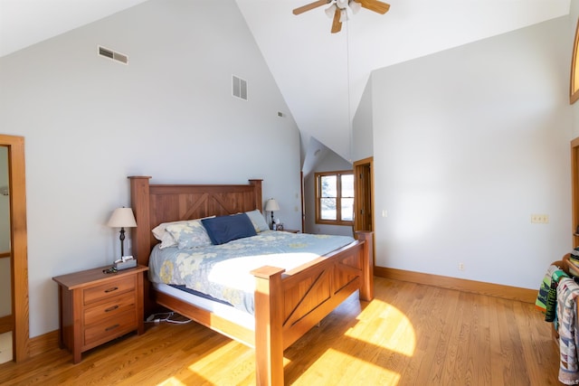 bedroom featuring ceiling fan, high vaulted ceiling, and light hardwood / wood-style floors