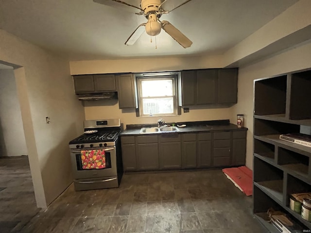 kitchen featuring sink, gray cabinetry, ceiling fan, and stainless steel gas range