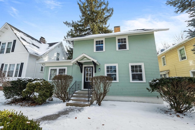 view of front of property featuring a chimney