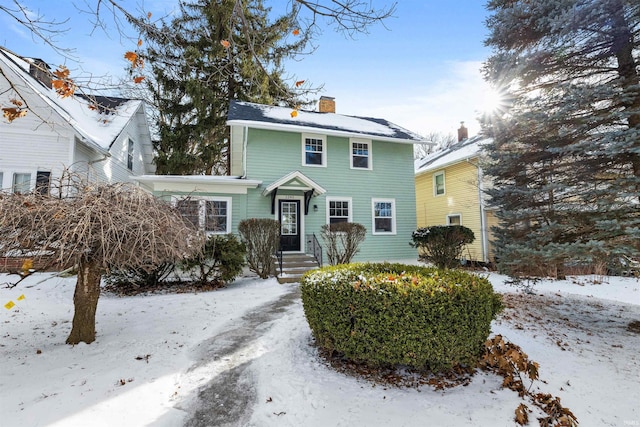 view of front of house with a chimney