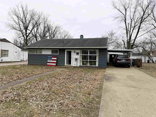 view of front of home with a carport