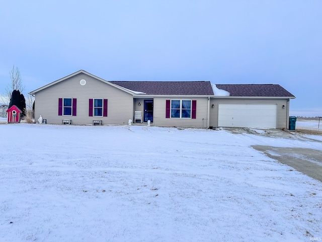 ranch-style house featuring a garage