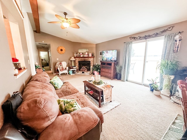 carpeted living room with lofted ceiling, ceiling fan, and a fireplace