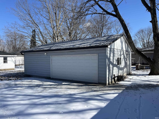 view of snow covered garage