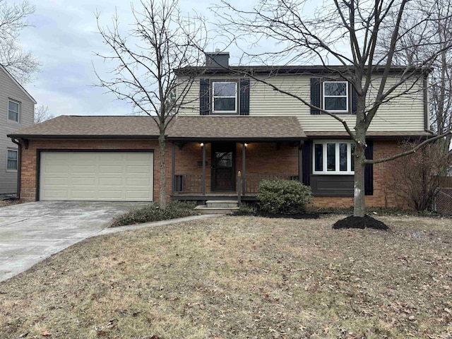 view of front property featuring a front lawn and a garage