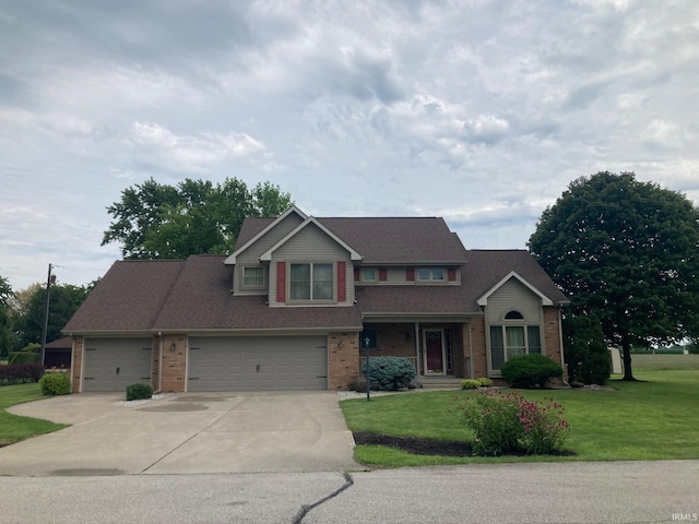 view of front of house with a garage and a front yard