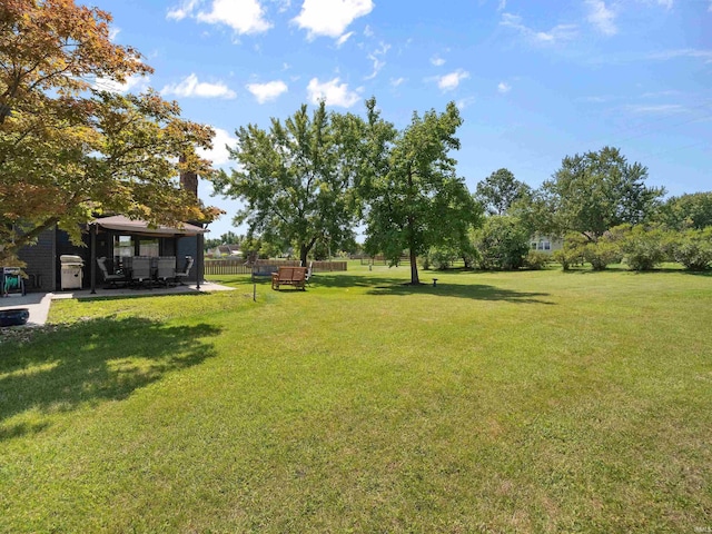 view of yard featuring a gazebo and fence