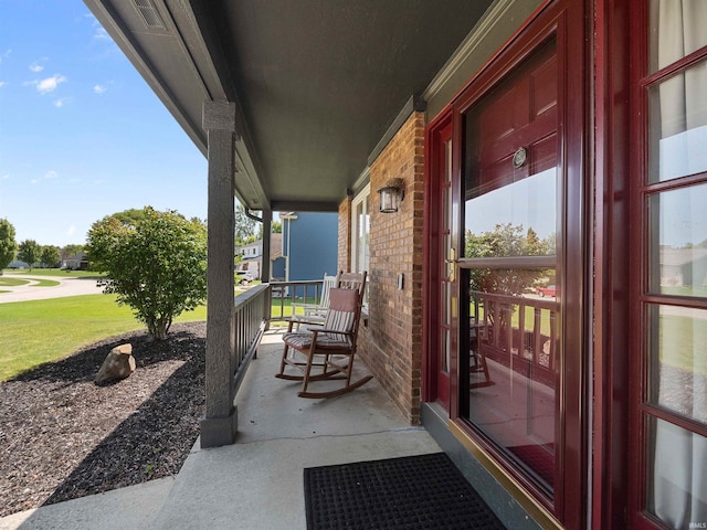 view of patio with covered porch and visible vents