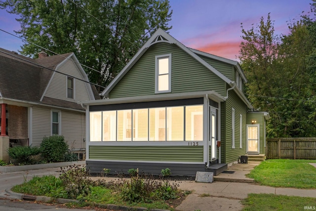 view of front of home with a sunroom