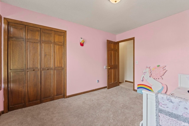 unfurnished bedroom with baseboards and light carpet