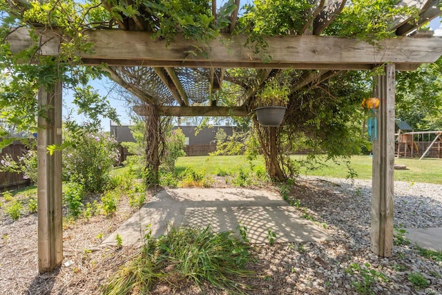 view of yard featuring fence and a patio