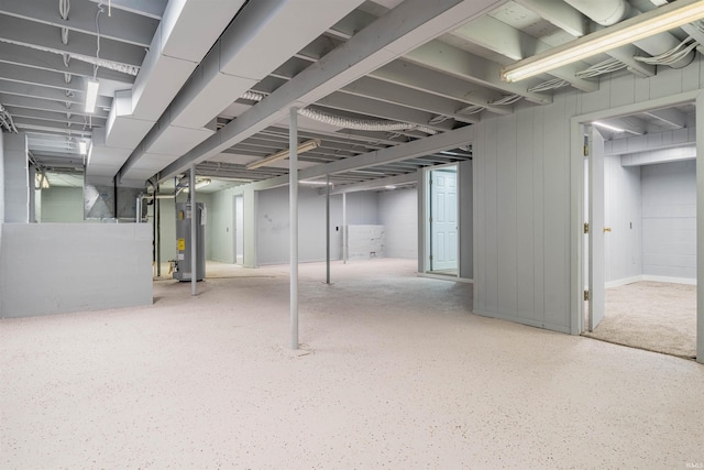 unfinished basement with water heater