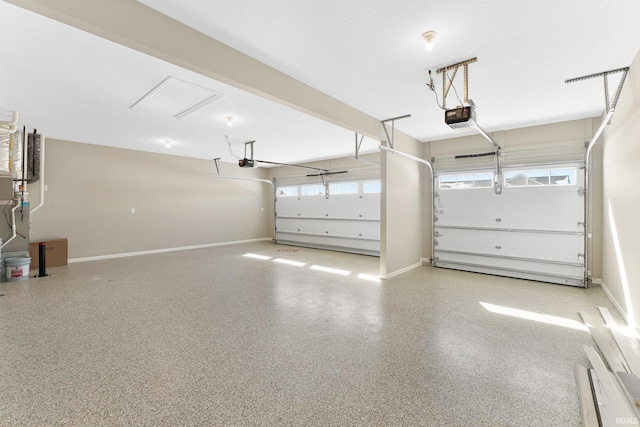 garage with a garage door opener and baseboards