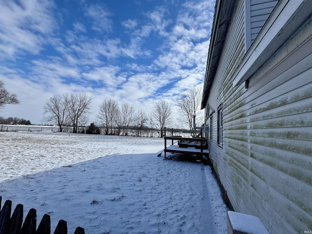 view of yard covered in snow