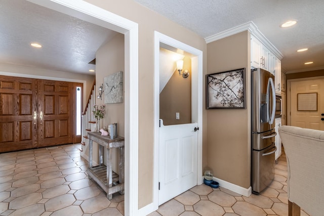 foyer entrance with baseboards, stairway, crown molding, a textured ceiling, and recessed lighting