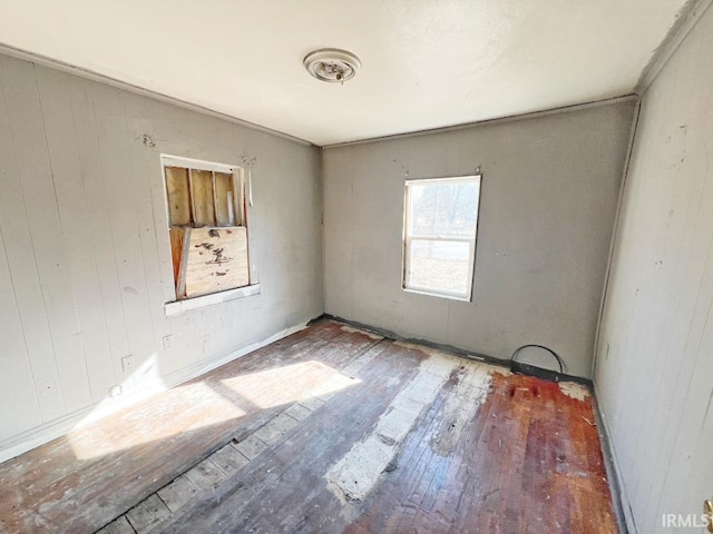 spare room featuring wood finished floors