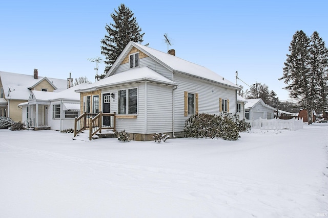 view of front of house featuring a chimney