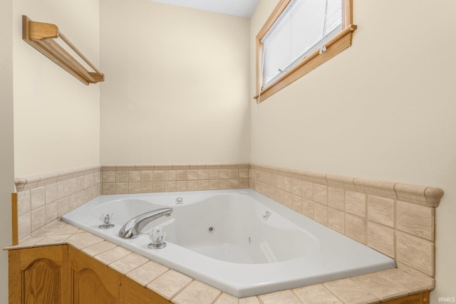 full bathroom with a jetted tub