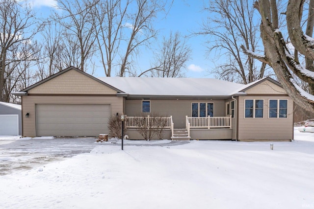 single story home with a garage and a porch