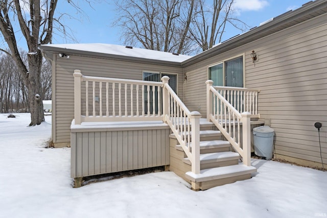 view of snow covered property entrance