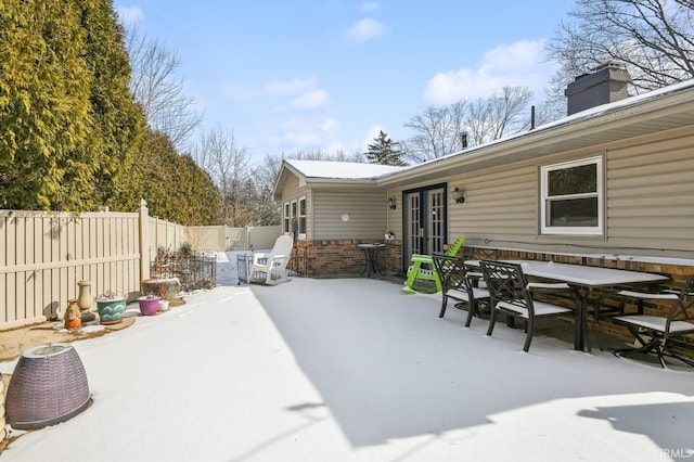 view of patio with french doors and a fenced backyard