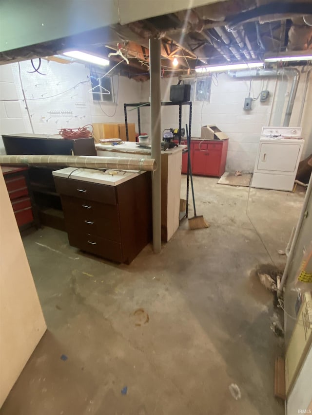 unfinished basement featuring washer / clothes dryer