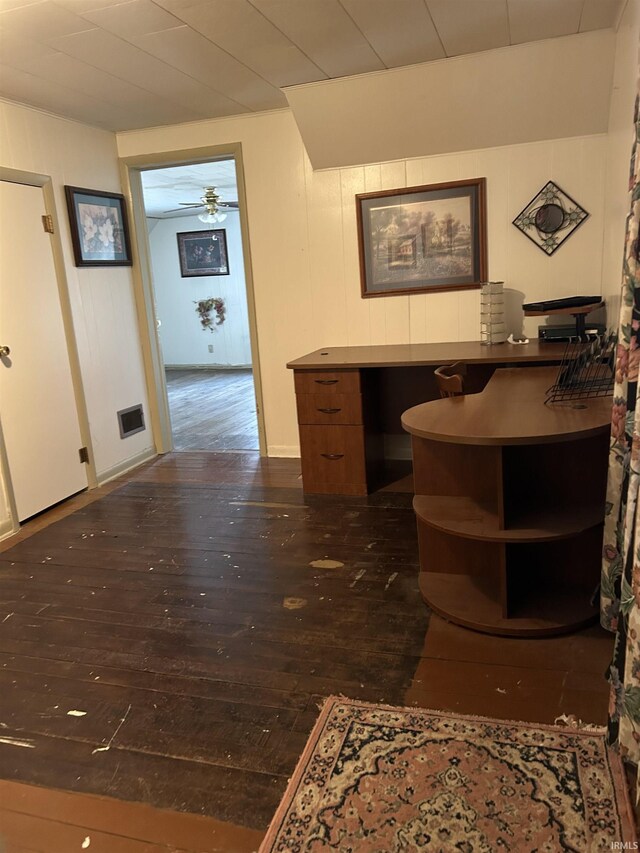 office space featuring visible vents, dark wood finished floors, and ceiling fan