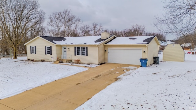 ranch-style house with an attached garage, driveway, and a chimney