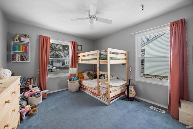 bedroom featuring carpet, baseboards, and ceiling fan