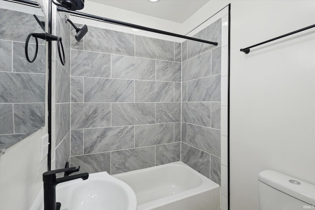 full bathroom featuring shower / tub combination, a sink, and toilet