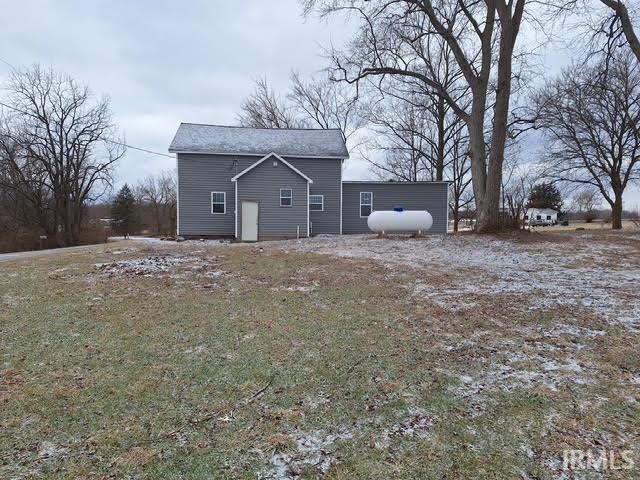 view of side of property featuring a yard