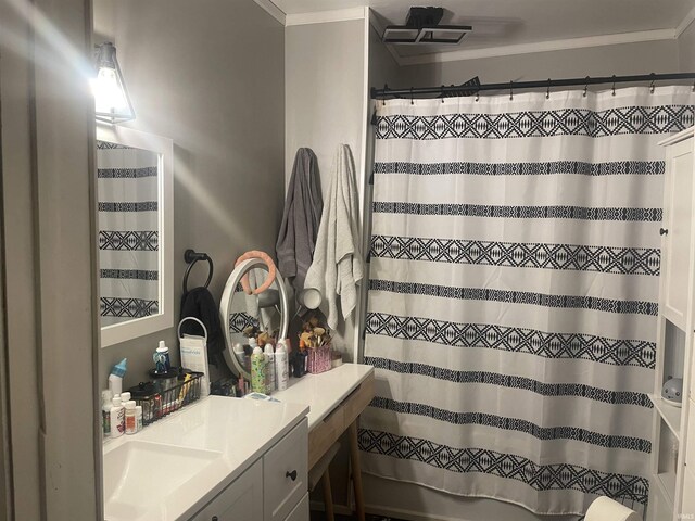 full bath featuring crown molding and vanity