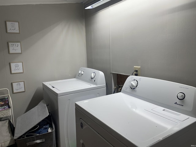 clothes washing area featuring laundry area and separate washer and dryer