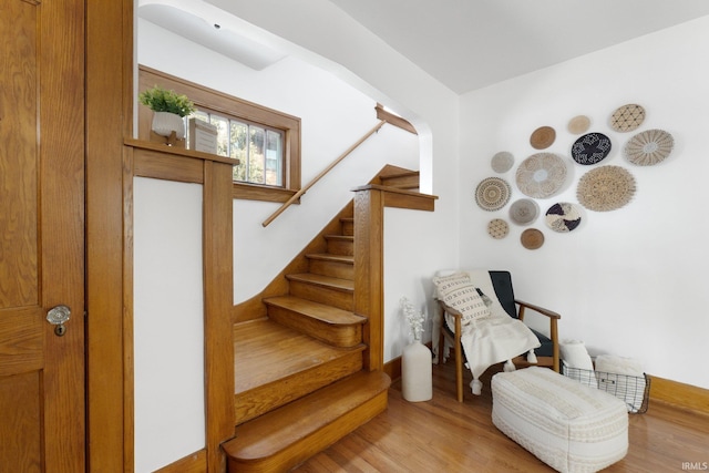 staircase featuring wood finished floors