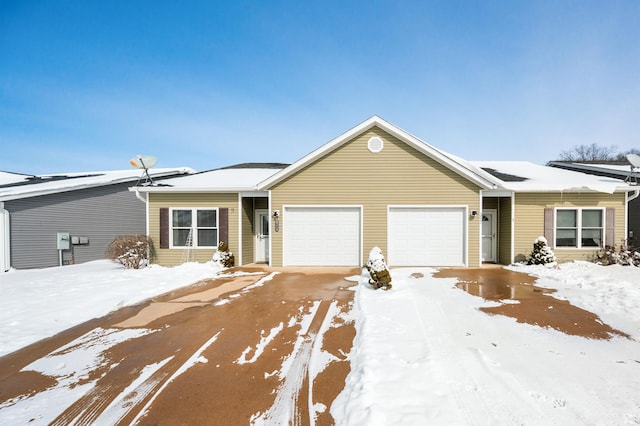 ranch-style home with a garage