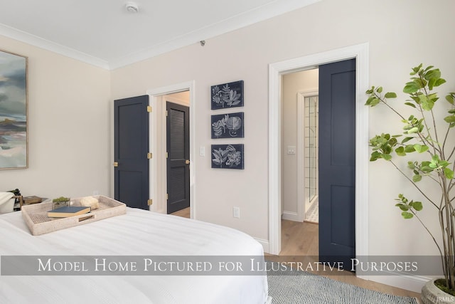 bedroom with ornamental molding, baseboards, and wood finished floors